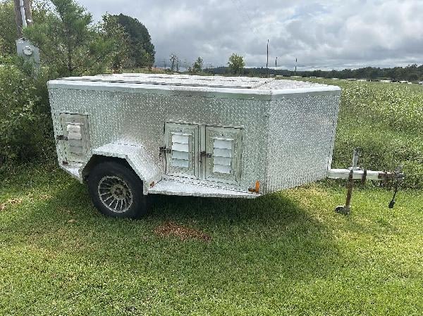 Dimond Aluminum six hole dog trailer.