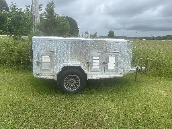 Dimond Aluminum six hole dog trailer.